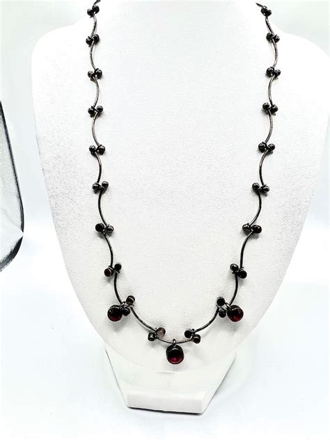 givenchy red garnet stone gunmetal necklace|givenchy rings for women.